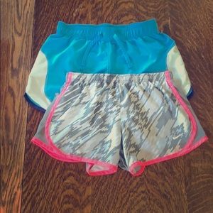 Two pairs of girls athletic shorts.